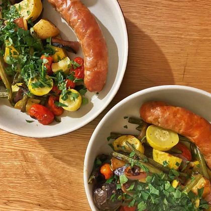 Roasted spring vegetables with spicy Italian sausage